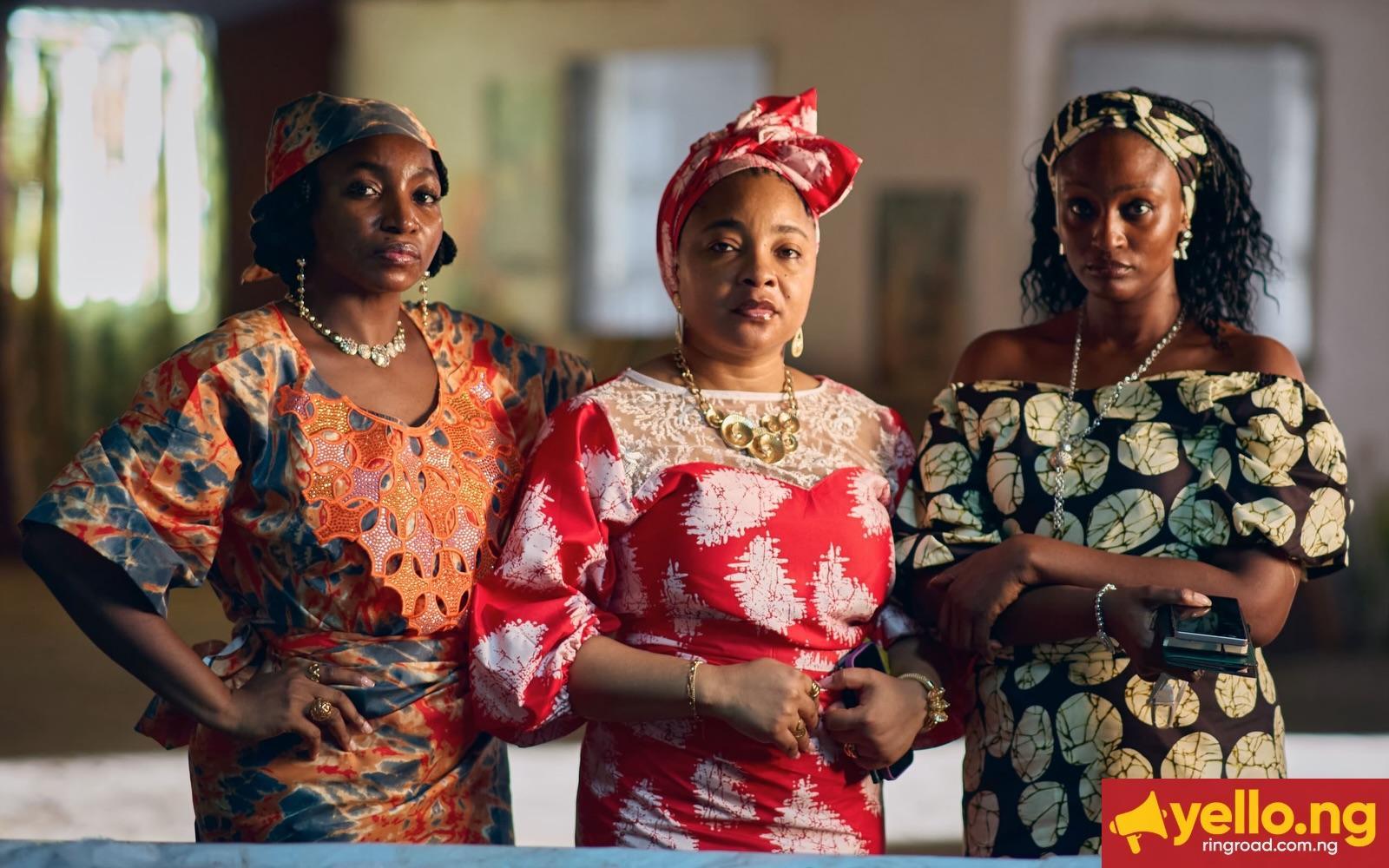 Omowunmi Dada, Linda Ejiofor-Suleiman, and Scarlet Gomez dressed in traditional patterned outfits for Black Market