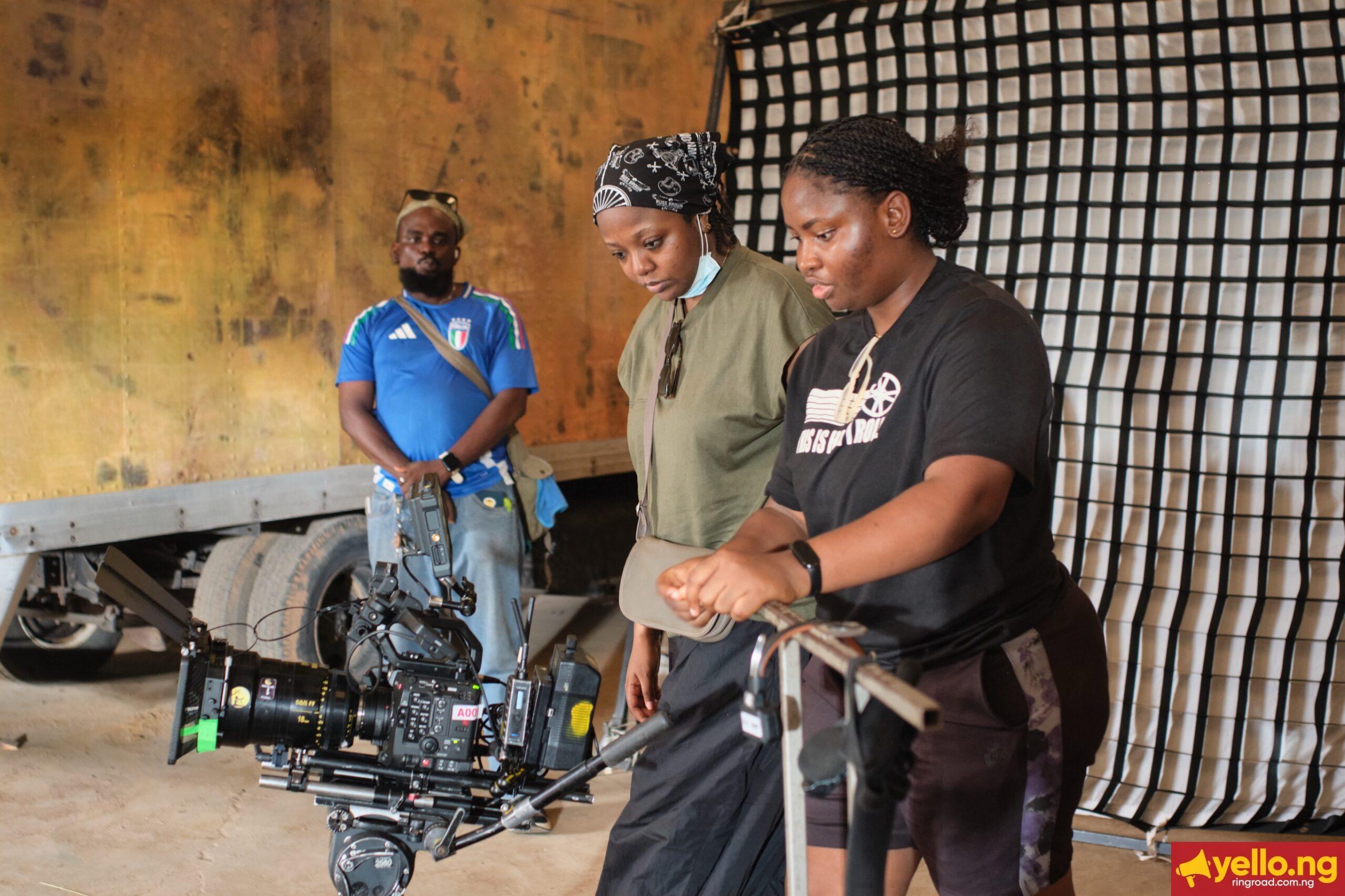 Producer Nora Awolowo and director Fatimah Binta Gimsay reviewing footage on camera monitor for Black Market