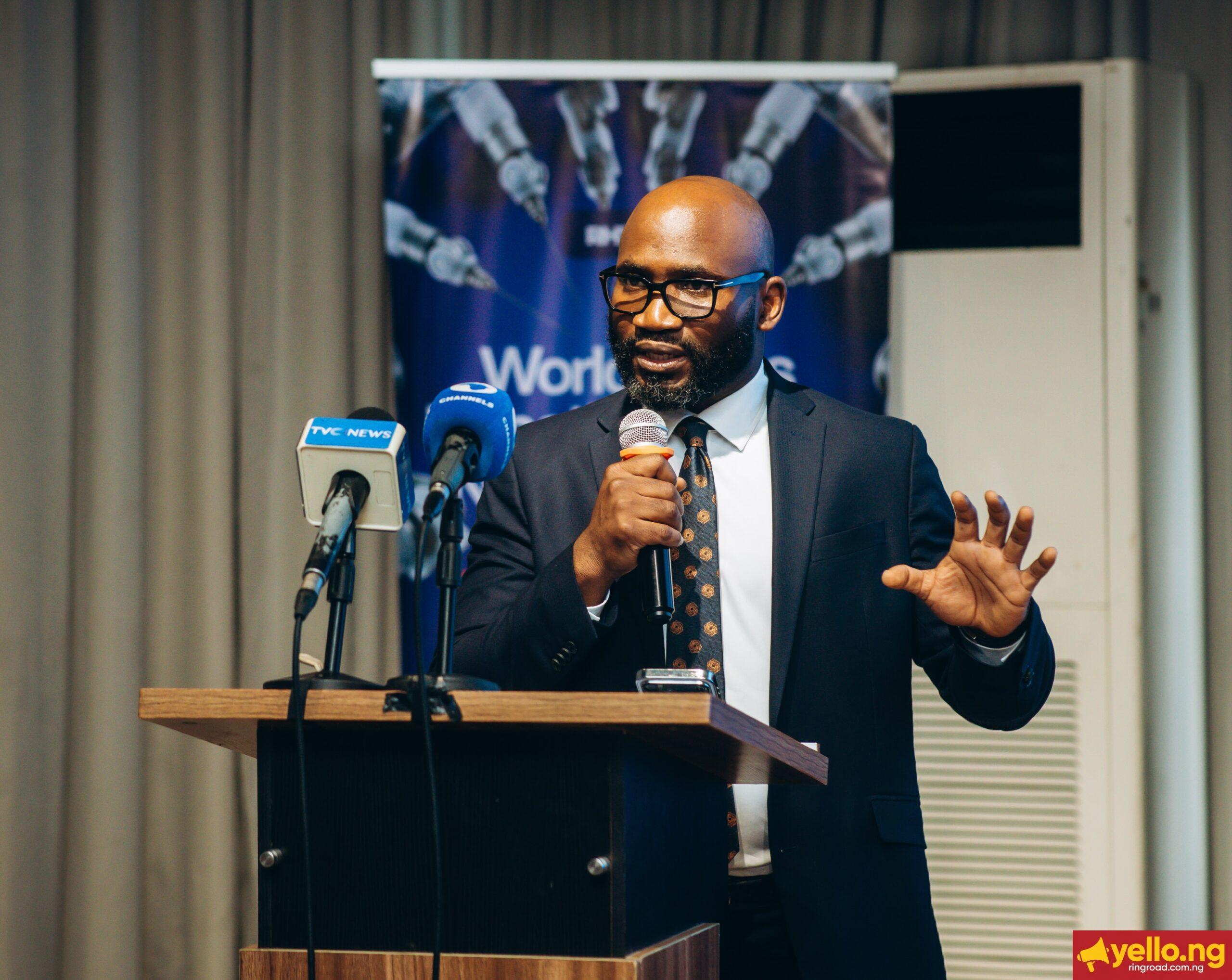 Professor Obi Davies-Ekwenna speaking at podium during Redeemer’s Health Village Robotics Surgery Launch Dinner following West Africa’s first tele-robotic surgery.