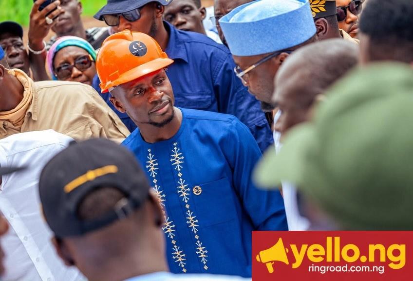 Sadio Mané wearing an orange safety hard hat and blue embroidered tunic at the SM10 Agro site in Bambali